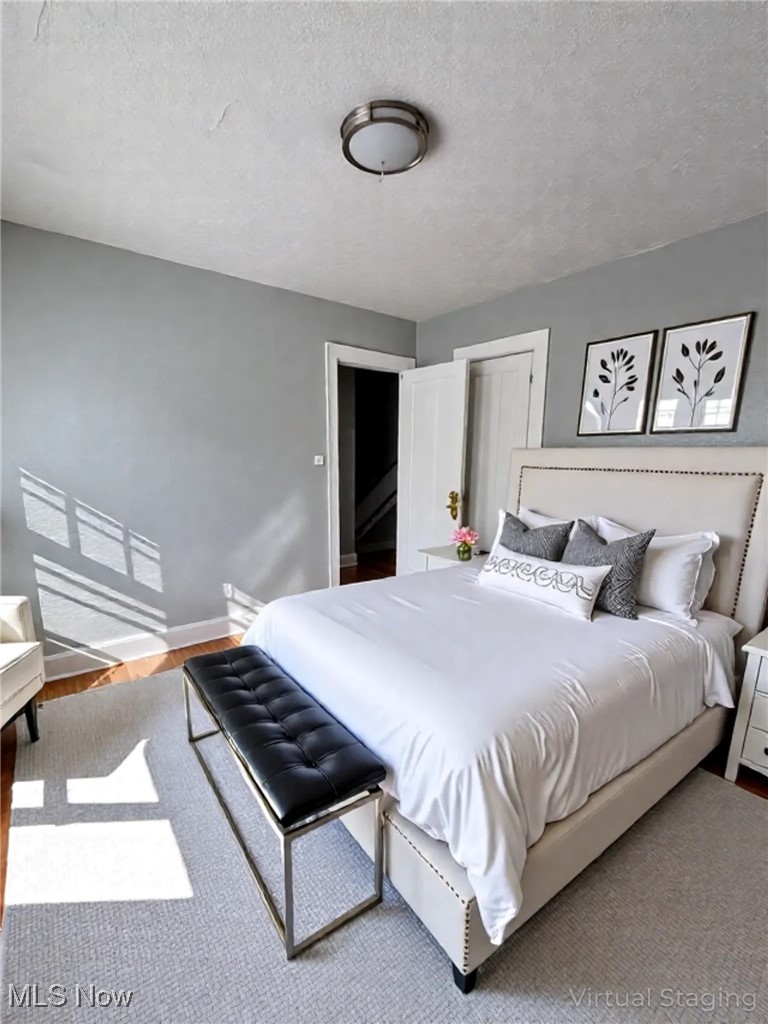 2121 Alton Road Cleveland, OH 44112 - Photo 24 of 44 Bedroom featuring a textured ceiling and light wood finished floors