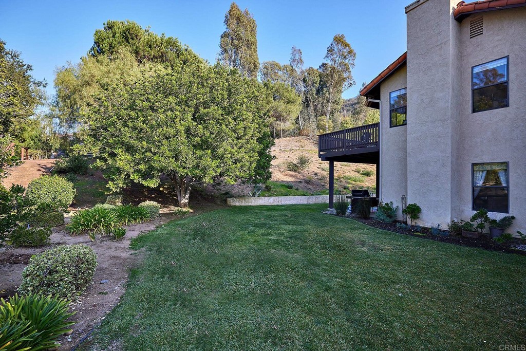 3518 Sarah Ann Drive Fallbrook, CA 92028 - Photo 16 of 49 a view of a backyard with table and chairs and potted plants