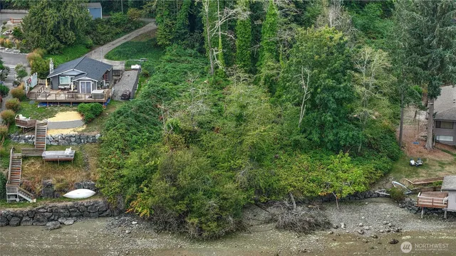 a view of a chairs and table in backyard