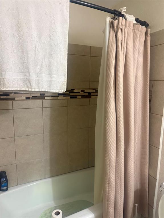 1117 Victoria Street Bellmead, TX 76705 - Photo 11 of 11 Full bath with shower / bath combination with curtain