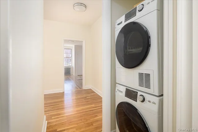 a view of a hallway with washer and dryer