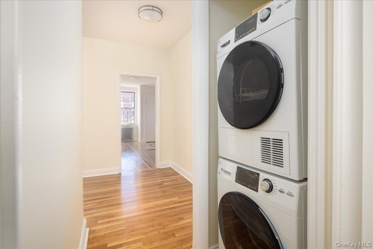 83-09 Talbot, Unit 6L Queens, NY 11415 - Photo 11 of 19 a view of a hallway with washer and dryer