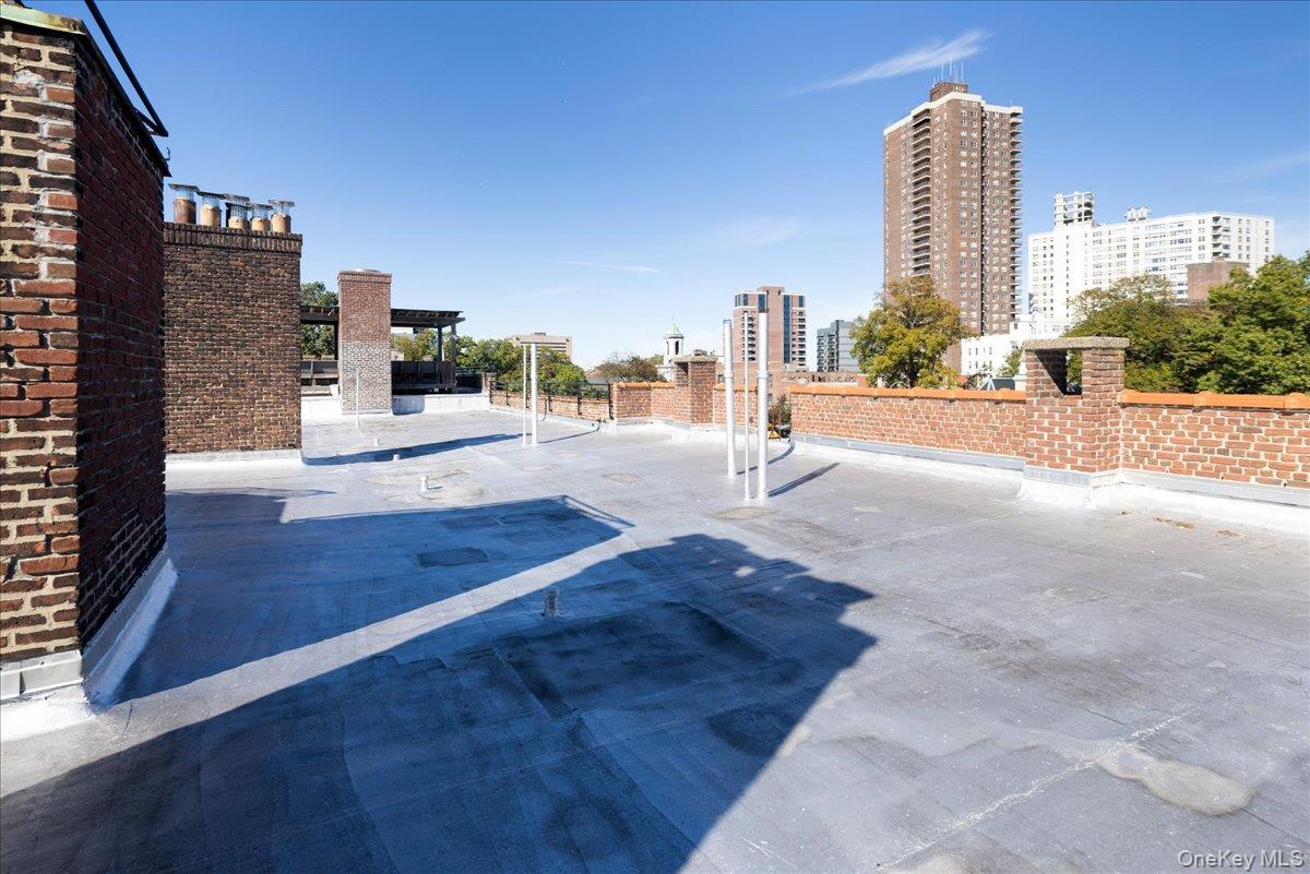 83-09 Talbot, Unit 6L Queens, NY 11415 - Photo 14 of 19 a view of a city with tall buildings