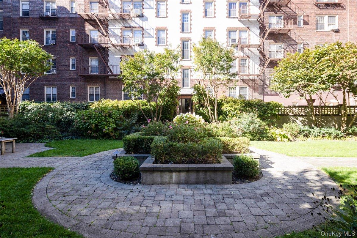 83-09 Talbot, Unit 6L Queens, NY 11415 - Photo 17 of 19 a view of a garden with a building