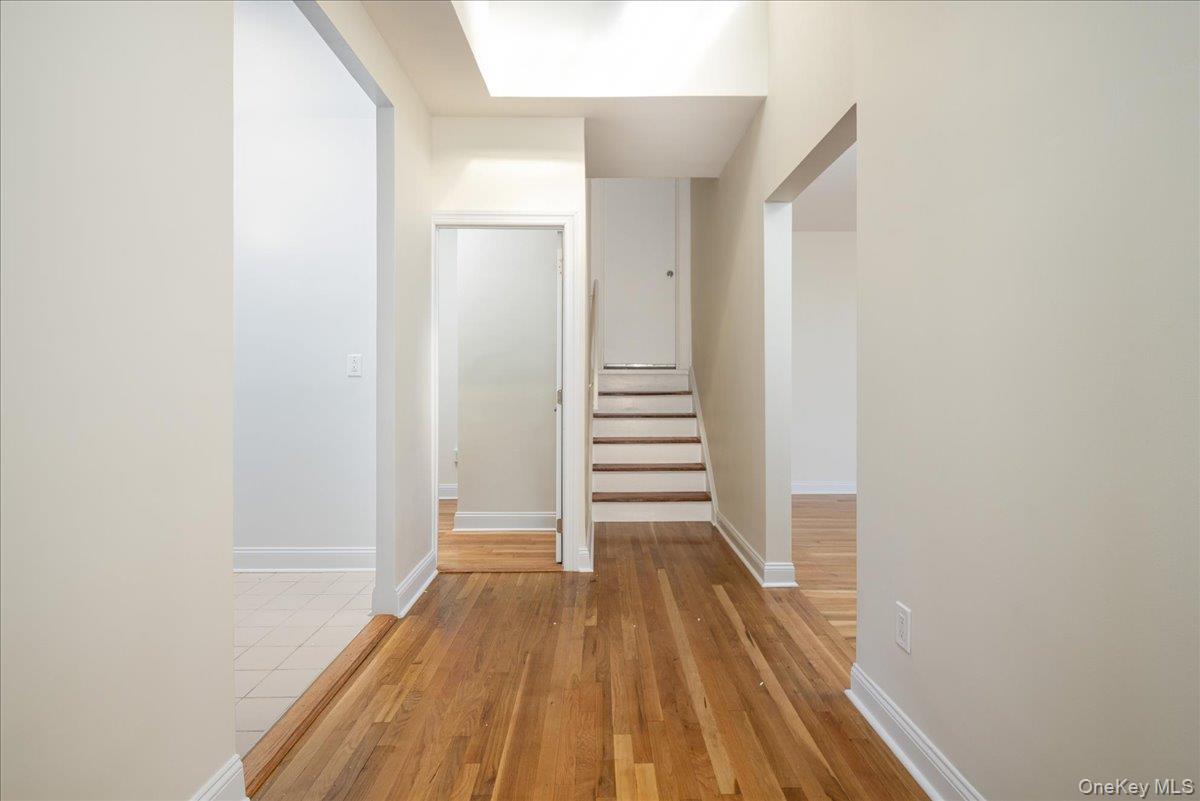 83-09 Talbot, Unit 6L Queens, NY 11415 - Photo 6 of 19 a view of a hallway with wooden floor and entryway