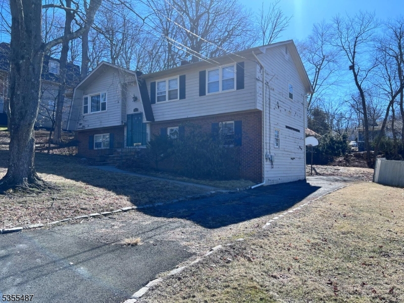 13 Arverne Road West Orange, NJ 07052 - Photo 4 of 9 a front view of a house with a yard