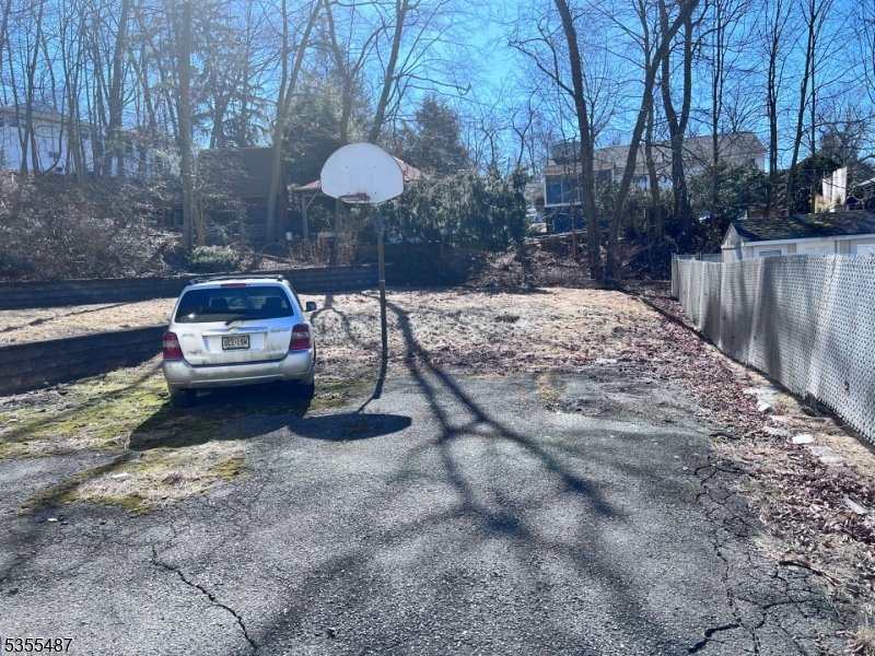13 Arverne Road West Orange, NJ 07052 - Photo 9 of 9 a view of a backyard with tv and trees