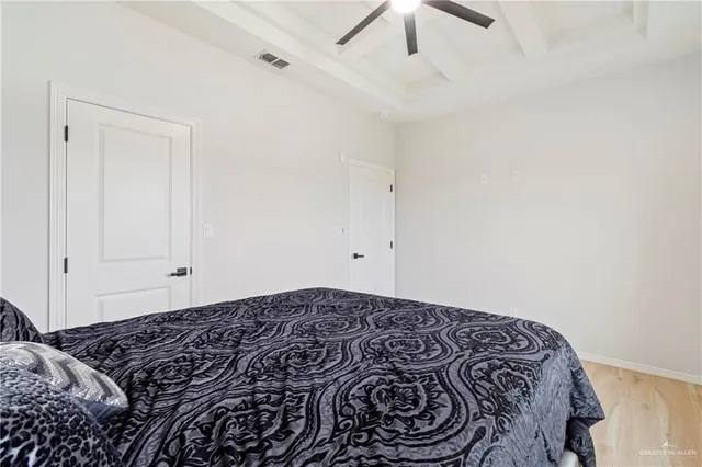 a bathroom with a sink a toilet and shower curtain