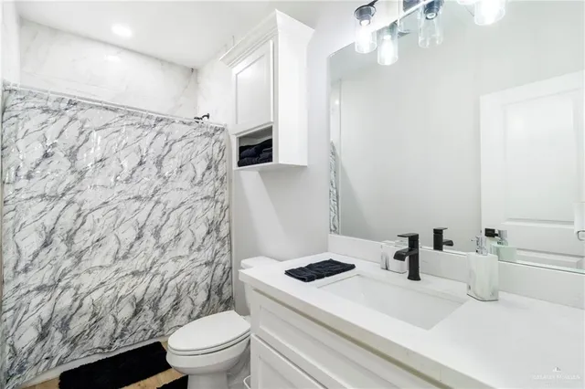 a bedroom with a bed and a table