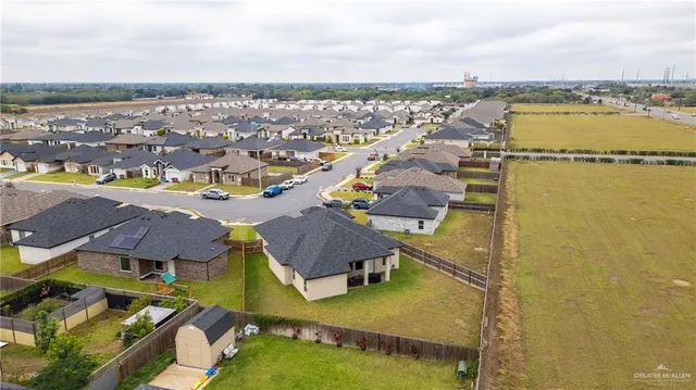 an aerial view of residential houses with outdoor space