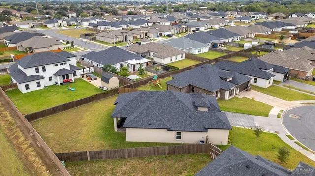 a aerial view of a house with a swimming pool
