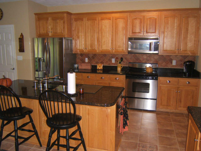 133 Piper Glenn Blue Ridge, VA 24064 - Photo 22 of 73 a kitchen with stainless steel appliances granite countertop a stove a sink dishwasher and microwave