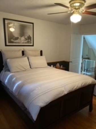 7 Willow Street Holyoke, MA 01040 - Photo 13 of 33 a bedroom with a bed and a painting on the wall