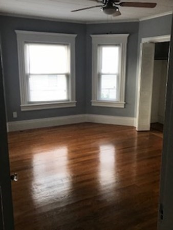 7 Willow Street Holyoke, MA 01040 - Photo 15 of 33 a view of empty room with wooden floor and fan