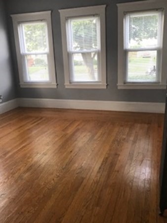 7 Willow Street Holyoke, MA 01040 - Photo 18 of 33 an empty room with wooden floor and windows