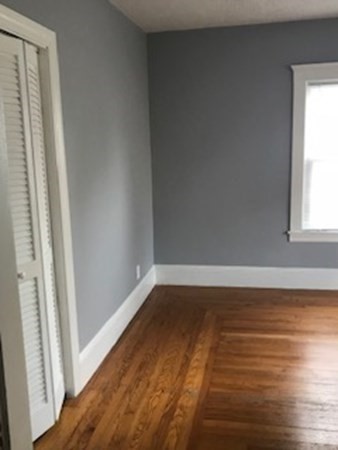 7 Willow Street Holyoke, MA 01040 - Photo 19 of 33 a view of a room with wooden floor and window