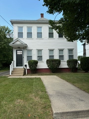 7 Willow Street Holyoke, MA 01040 - Photo 2 of 33 a front view of a house with a garden