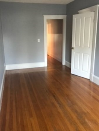 7 Willow Street Holyoke, MA 01040 - Photo 21 of 33 a view of empty room with wooden floor and fan