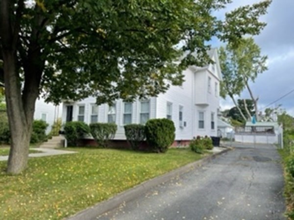 7 Willow Street Holyoke, MA 01040 - Photo 26 of 33 a front view of a house with a garden