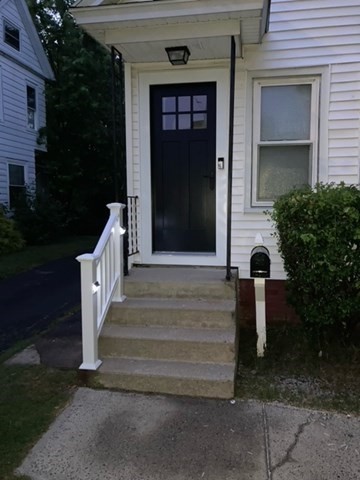 7 Willow Street Holyoke, MA 01040 - Photo 29 of 33 a front view of a house with entryway