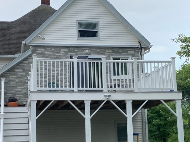 7 Willow Street Holyoke, MA 01040 - Photo 30 of 33 a roof deck with table and chairs