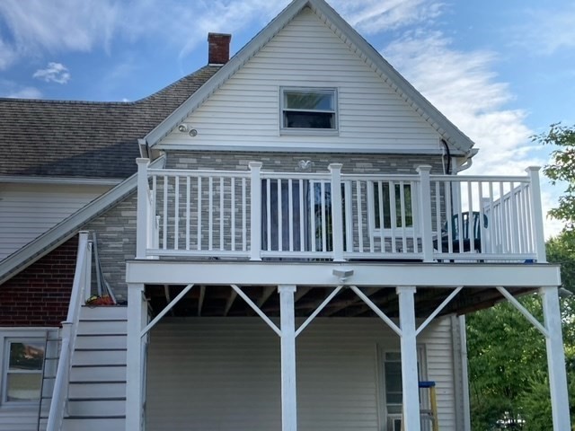 7 Willow Street Holyoke, MA 01040 - Photo 31 of 33 a view of a house with wooden deck and furniture