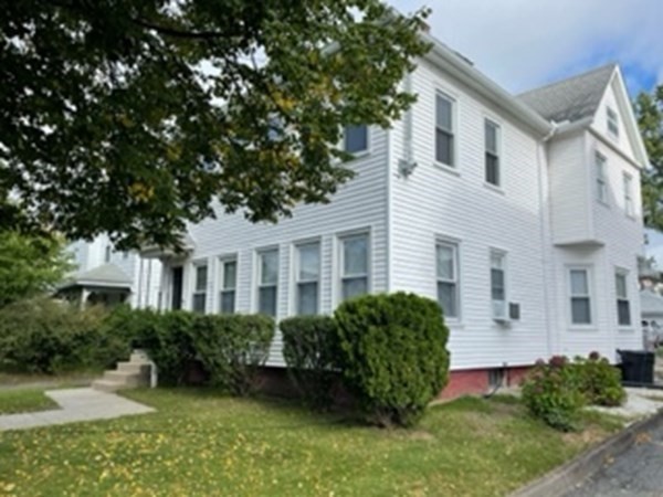 7 Willow Street Holyoke, MA 01040 - Photo 5 of 33 a front view of a house with garden