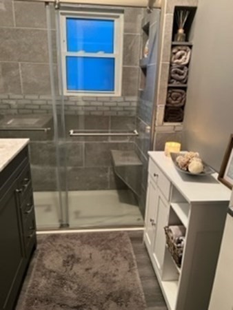 7 Willow Street Holyoke, MA 01040 - Photo 10 of 33 a bathroom with a tub sink and mirror