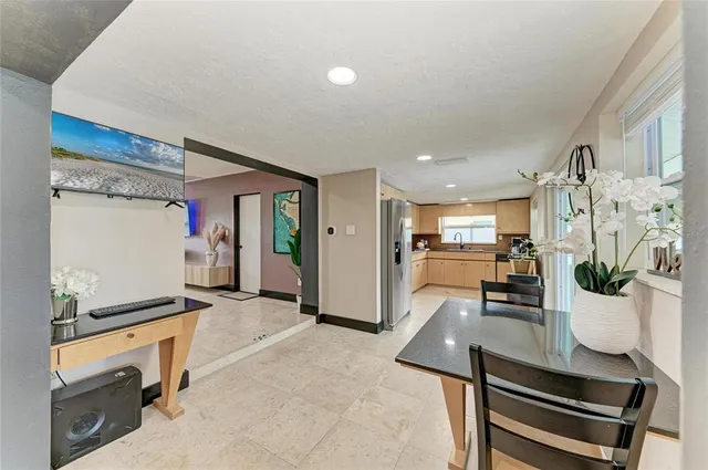 a dining room with furniture and window