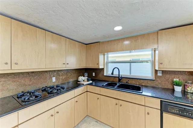 a view of staircase with white walls and a window