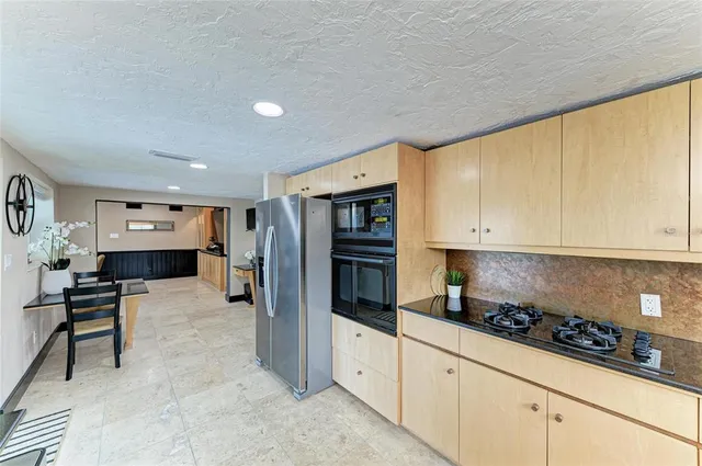 a bed room with a bed and a large window