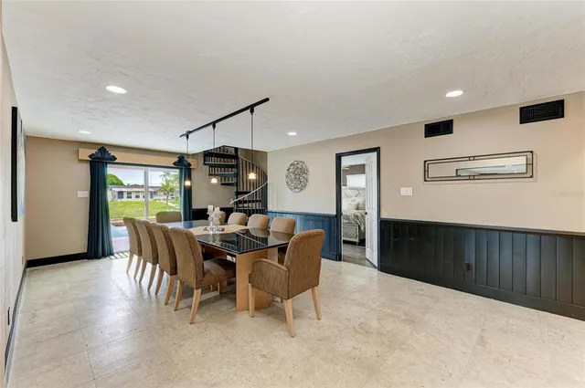 a bedroom with a large bed and a flat screen tv