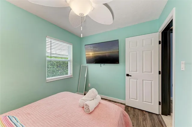a bathroom with a granite countertop sink toilet a mirror and shower
