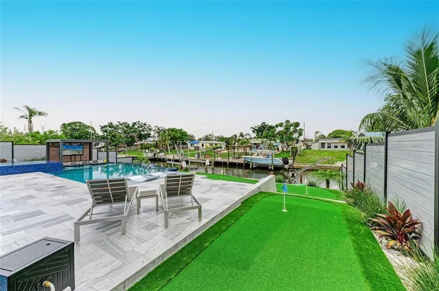 a view of a chairs and table on the wooden floor