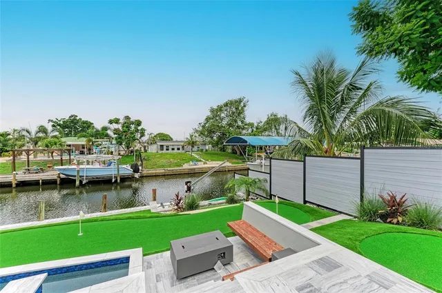 a view of a living room with red couch