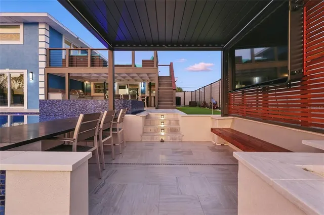 a view of a patio with a table and chairs