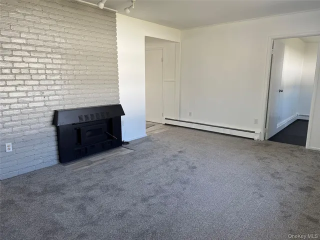 a view of an empty room and closet area