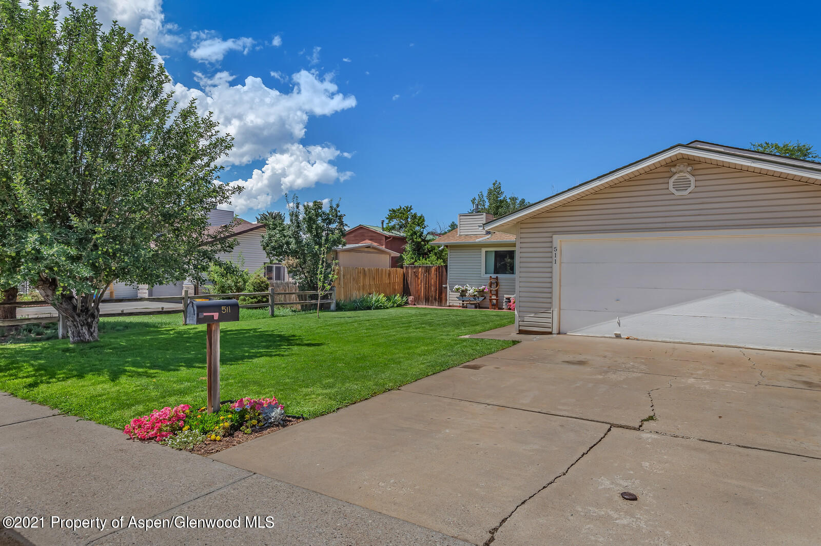 511 Fairway Avenue Rifle, CO 81650 - Photo 4 of 17 a front view of a house with a garden
