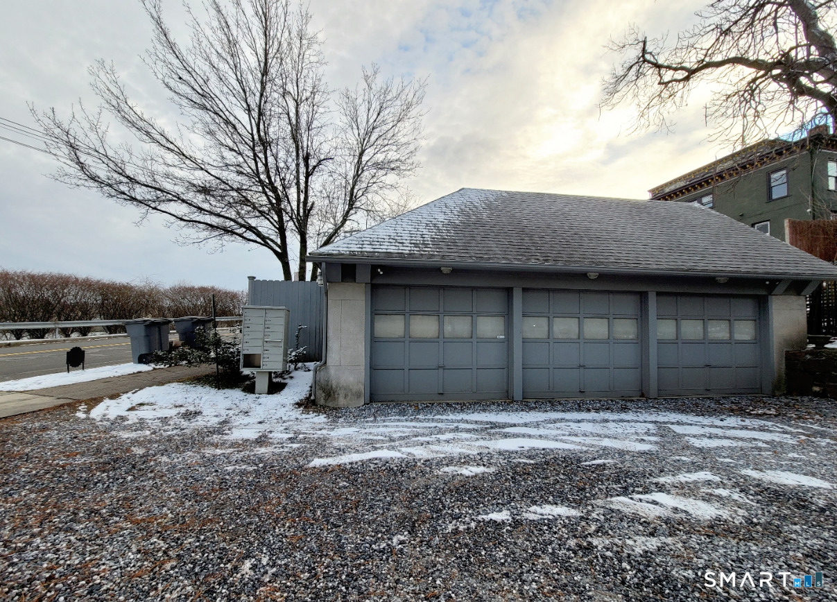 2 Front Street, Unit 2J New Haven, CT 06513 - Photo 15 of 15 a front view of a house with a yard and garage