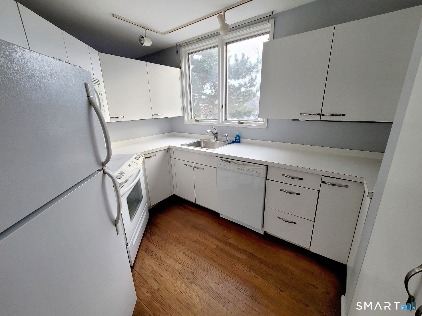 2 Front Street, Unit 2J New Haven, CT 06513 - Photo 4 of 15 a kitchen with sink cabinets and window