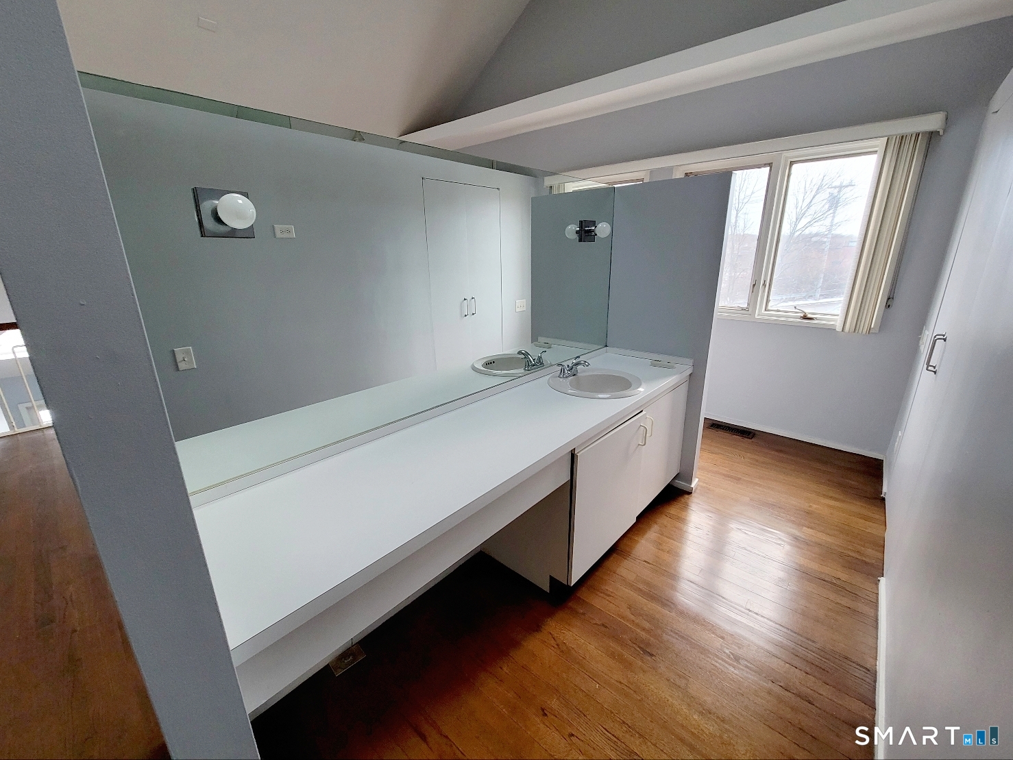 2 Front Street, Unit 2J New Haven, CT 06513 - Photo 10 of 15 a spacious bedroom with a bed and wooden floor