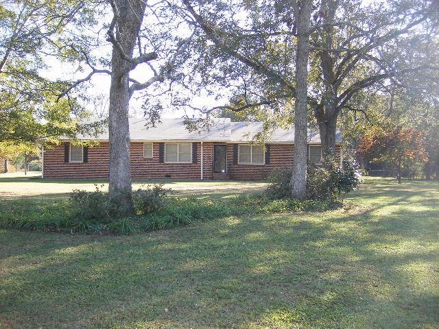 115 Price Drive Locust Grove, GA 30248 - Photo 1 of 1 a view of a house with a yard
