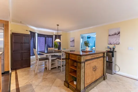 a dining room with furniture window and outside view