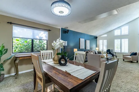 a bed room with a bed and a chandelier