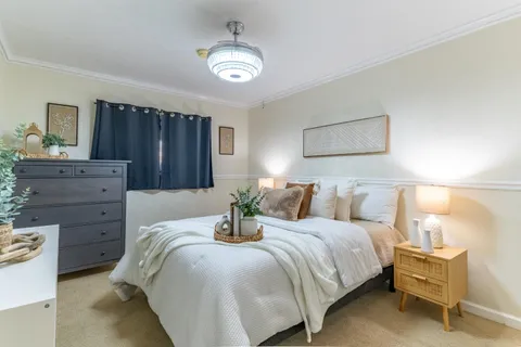 an aerial view of multiple houses with yard