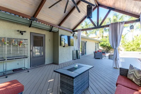 an aerial view of a house with a yard and garden