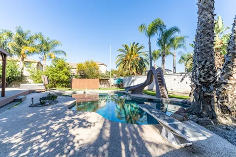 a bathroom with a toilet a sink and a mirror