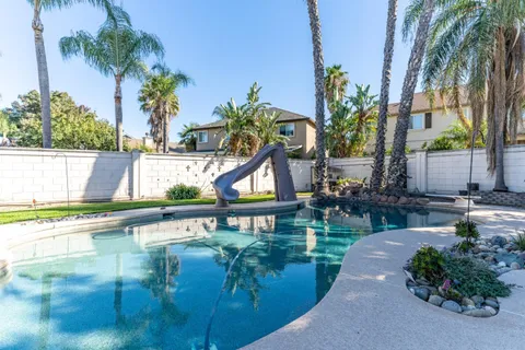 a bed room with a bed and a desk