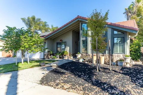 a kitchen with stainless steel appliances granite countertop a stove and a sink