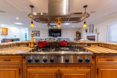 a kitchen with a stove and a microwave